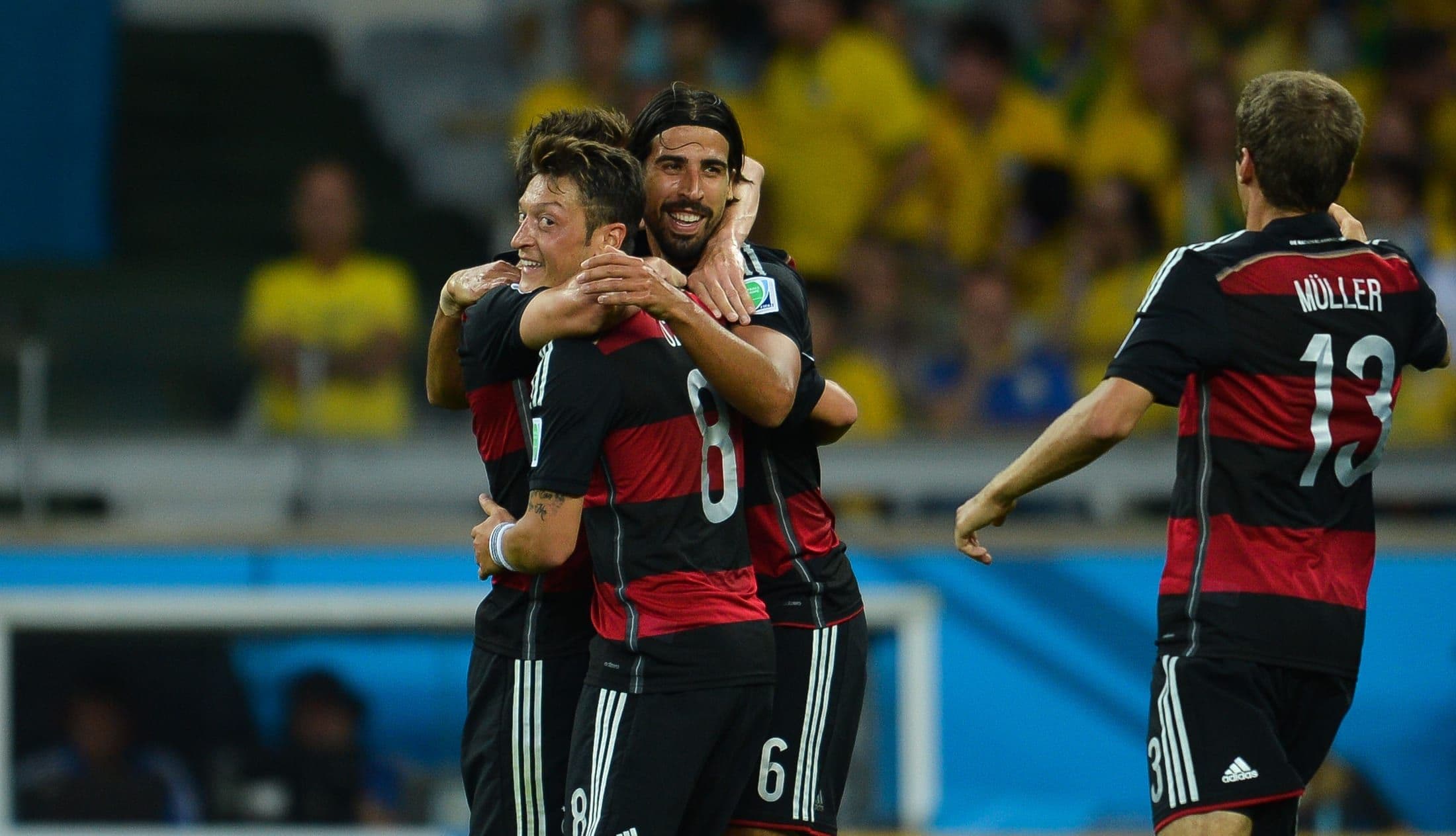 German players celebrating during the 2014 World Cup semi-final against Brazil
