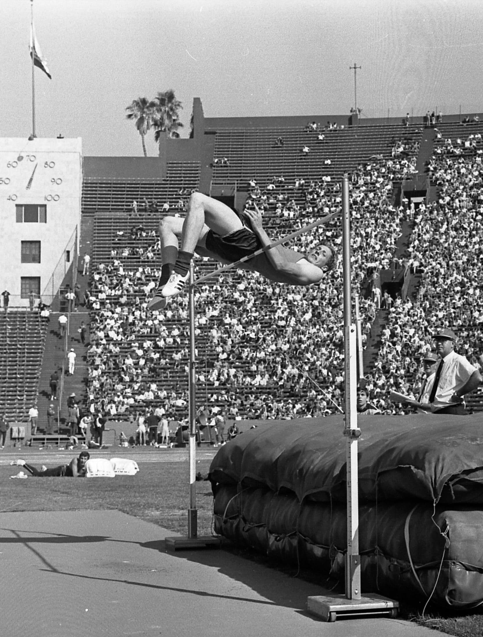 Dick Fosbury clearing the high jump bar using his back-first technique, 1968