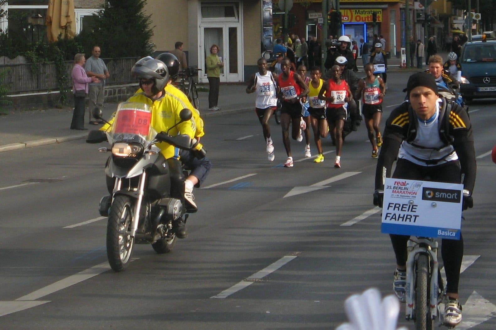 Haile Gebrselassie running among the lead pack of East African distance runners