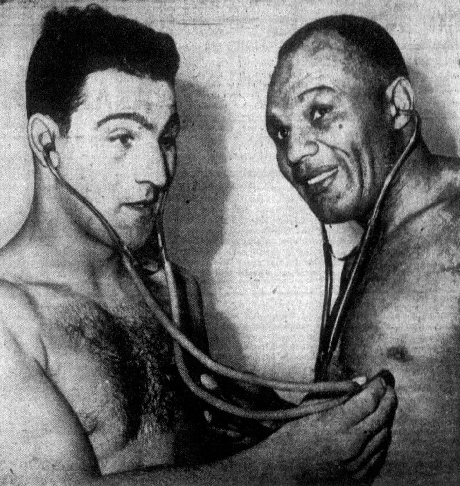 A vintage newspaper photograph of two boxers from the early 1950s