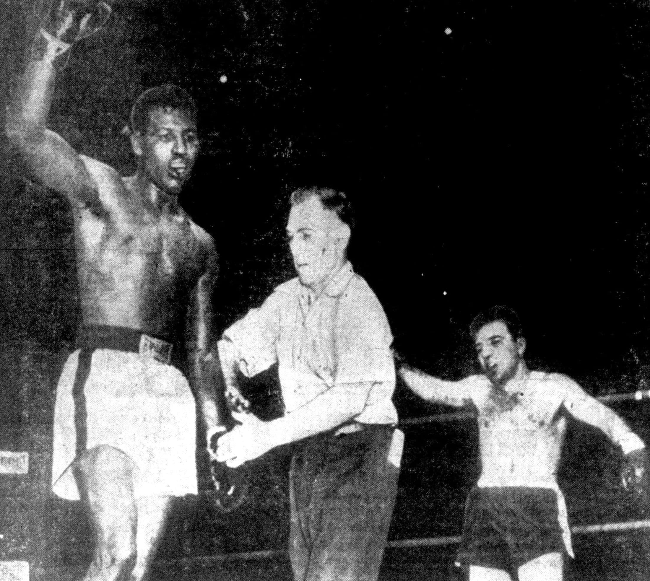 Sugar Ray Robinson celebrating in the ring after a fight, 1951